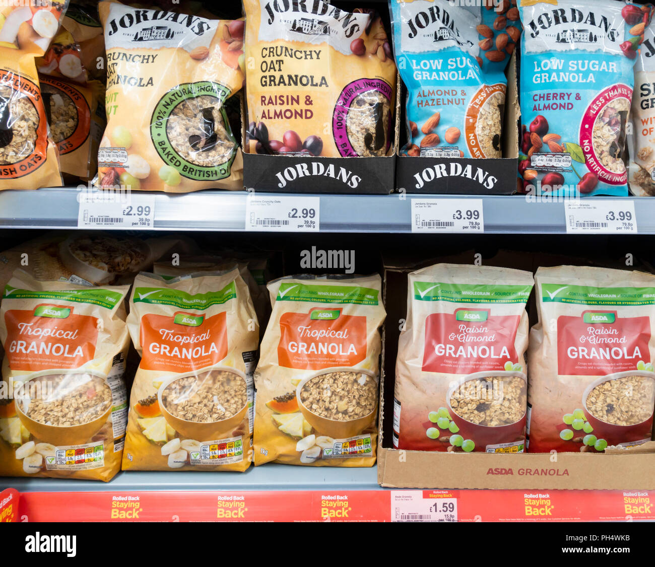 Asda own brand Granola breakfast cereal and Jordan`s Granola in Asda supermarket. UK Stock Photo